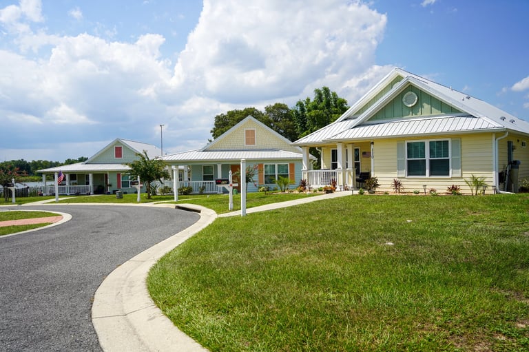 A row of luxury homes with manicured lawns