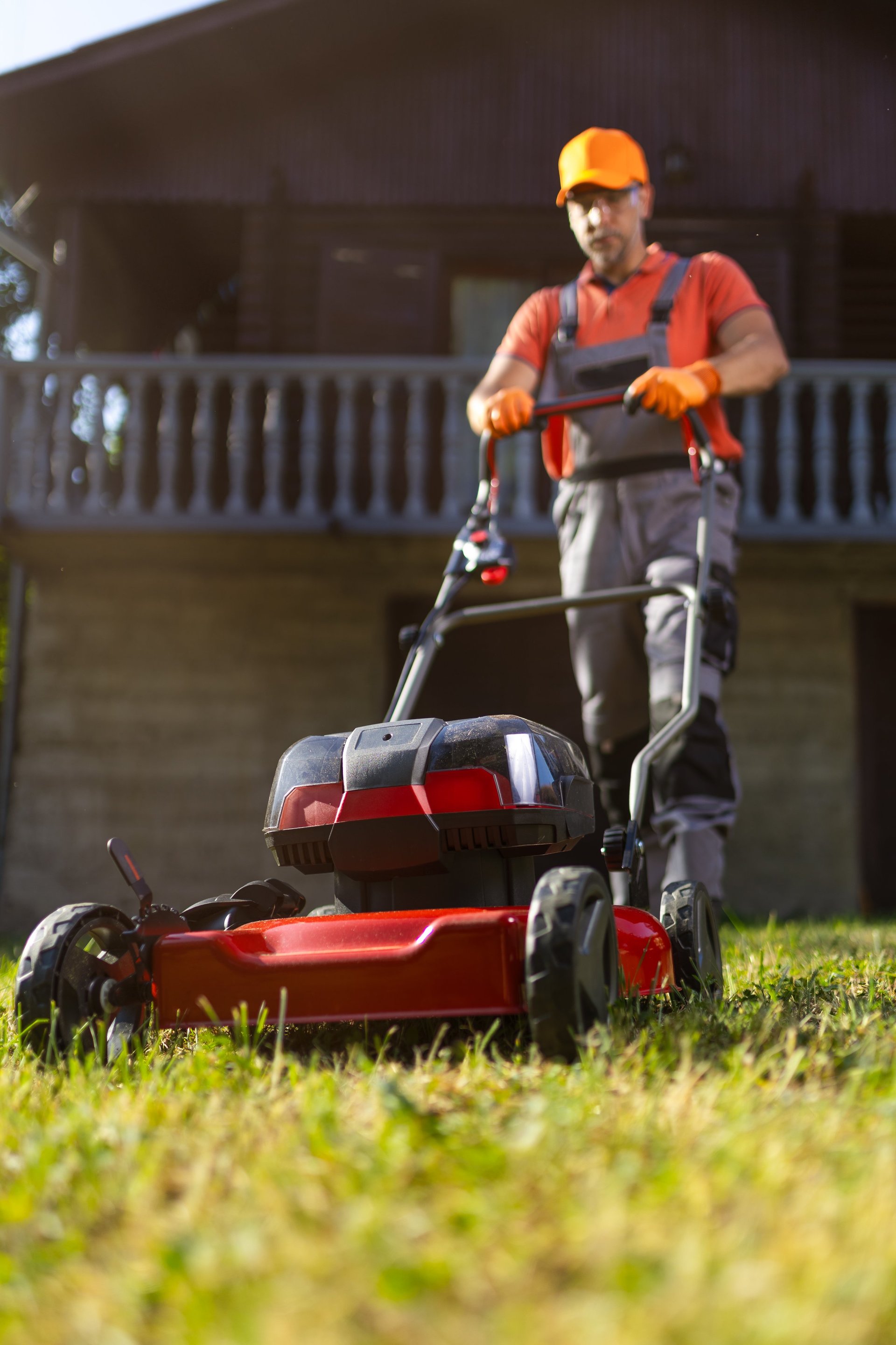Professional lawn care service in St. Cloud Florida - gardener maintaining a lush green lawn